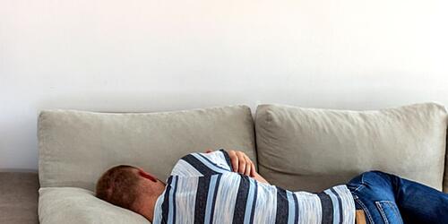 Person sleeping on sofa